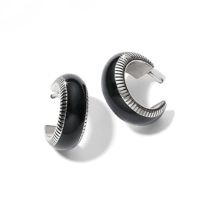 Brighton hoop earrings with black enamel and silver-plated ribbed edge detailing on a white background