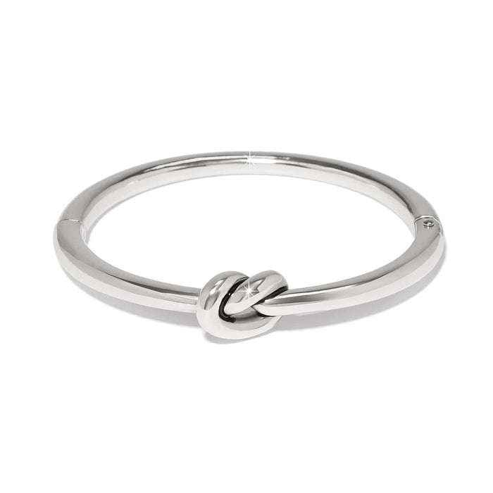 Brighton bangle bracelet with silver-tone polished finish and central love knot design on a white background