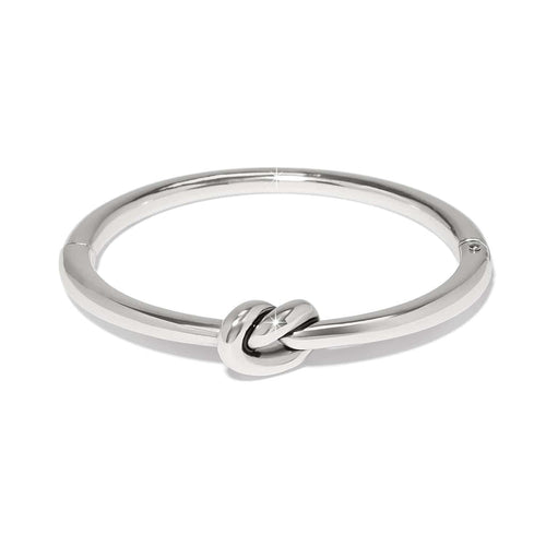 Brighton bangle bracelet with silver-tone polished finish and central love knot design on a white background