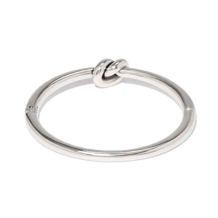 Brighton bangle bracelet with silver-plated finish and central knot detail, shown from a side angle on a white background