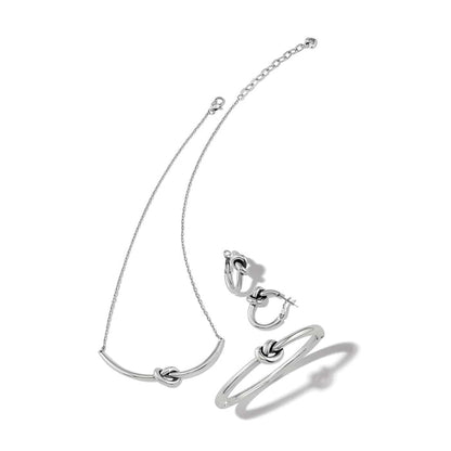 Brighton silver-tone jewelry set with knotted bar necklace, knotted hoop earrings, and knotted bangle bracelet on a white background