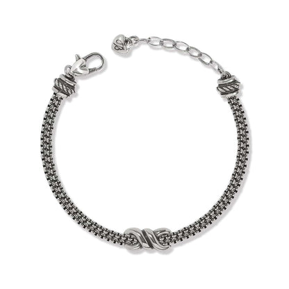 Brighton bracelet with silver-plated multi-strand chain, center knot accent, lobster clasp, and heart charm on a white background