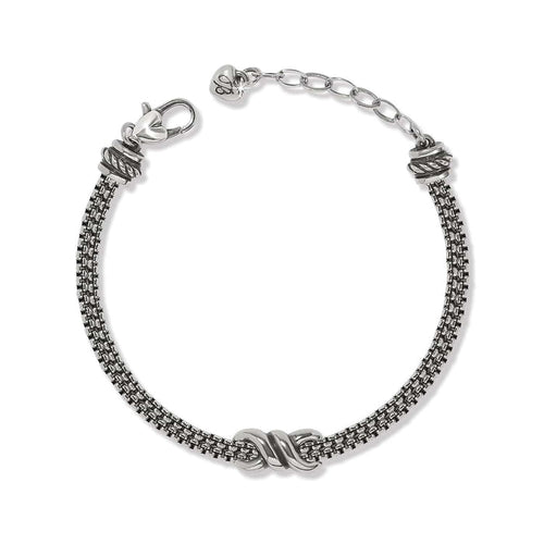 Brighton bracelet with silver-plated multi-strand chain, center knot accent, lobster clasp, and heart charm on a white background
