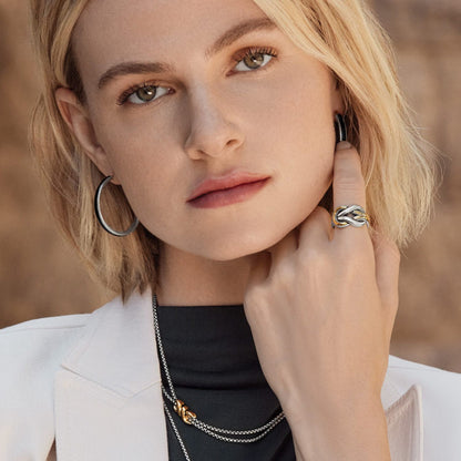 Model wearing Brighton silver hoop earrings and two-tone knot ring with coordinating Brighton silver chain necklaces