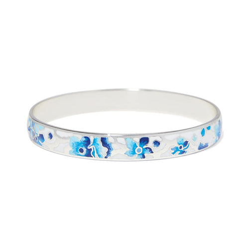 Brighton bangle bracelet with silver-plated finish and blue and white enamel floral design on a white background