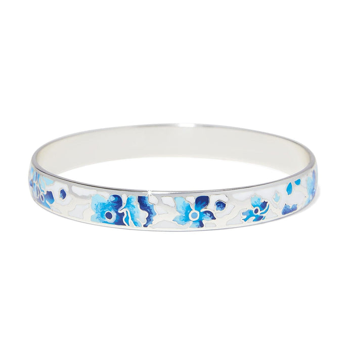 Brighton silver-plated bangle bracelet with blue and white enamel floral design on a white background