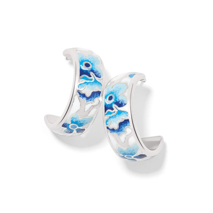 Brighton hoop earrings with blue and white floral enamel design and silver-plated finish on a white background