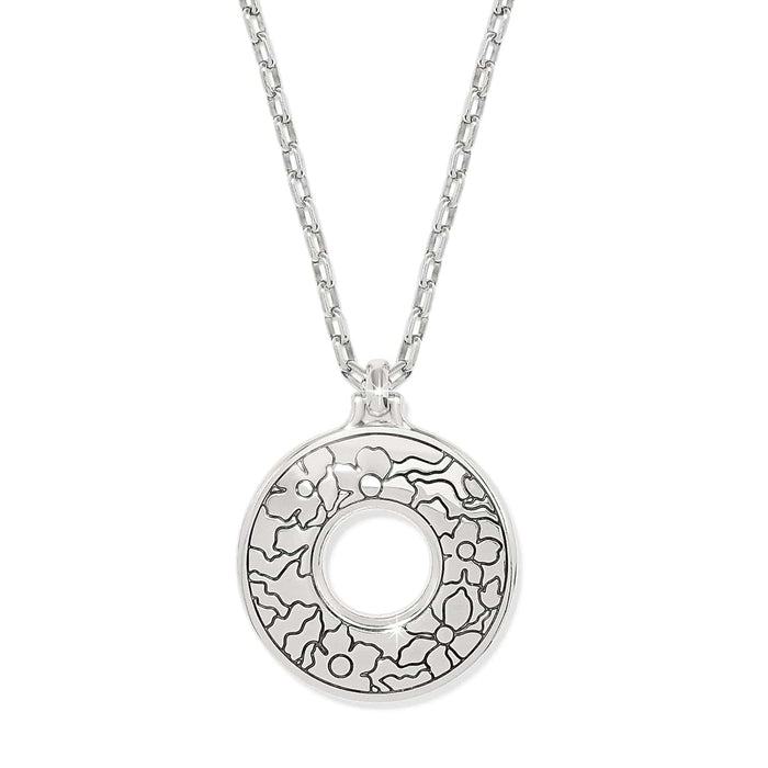 Brighton pendant necklace with silver-plated open circle charm featuring etched floral design and chain on a white background