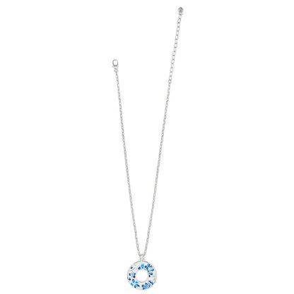 Brighton pendant necklace with silver-plated chain and circular pendant featuring blue enamel floral design on a white background