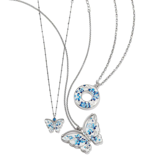Brighton silver-plated necklaces with blue floral enamel butterfly and circle pendants featuring crystal accents on a white background