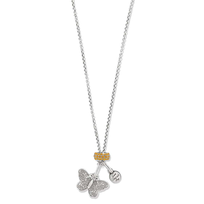 Brighton charm necklace with silver-plated butterfly, engraved disc, and yellow crystal bead accents on a white background