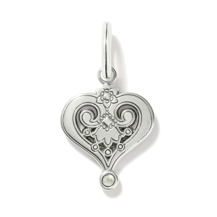 Brighton heart charm shown from the back with silver-plated scrollwork, floral detail, and small bead accent on a white background