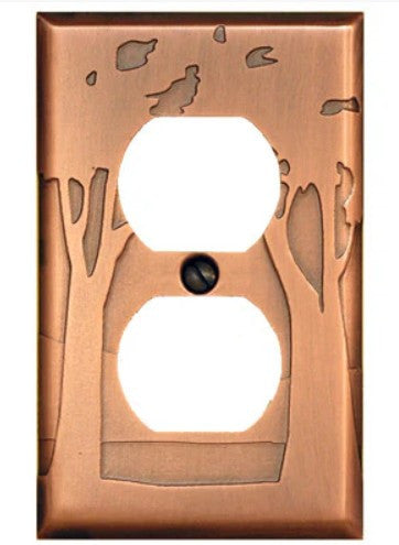 Copper wall plate with tree and bird design on a white background