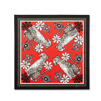 Brighton scarf with red leopard and floral print, black border, and white trim on a white background