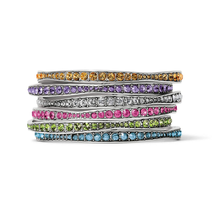 Brighton silver-plated bangle bracelets stacked with orange, purple, white, pink, green, and blue crystals on a white background