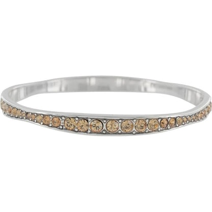 Brighton silver-plated bangle bracelet with row of orange fine quality crystals and beaded detailing on a white background