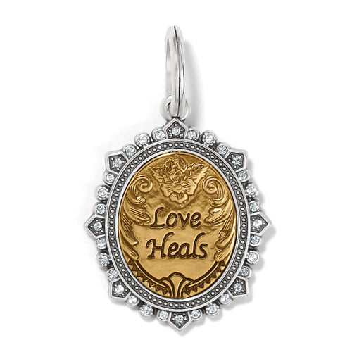 Brighton oval Love Heals charm with two-tone finish and crystal-accented silver-tone frame on a white background