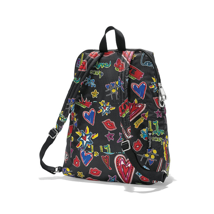 Brighton backpack shown from the back with colorful graffiti-style print of hearts, stars, and lips on a white background