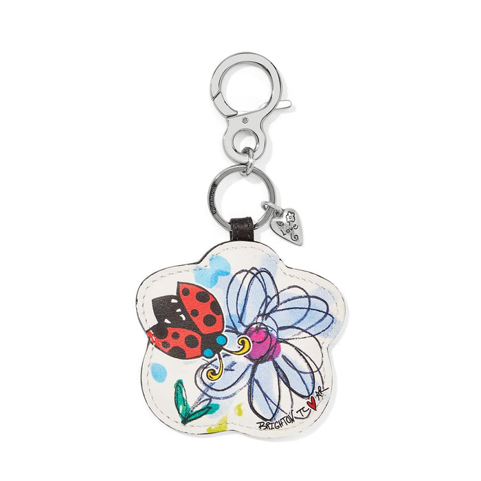 Brighton flower-shaped leather bag charm with ladybug and blue floral print and silver-tone clasp on a white background