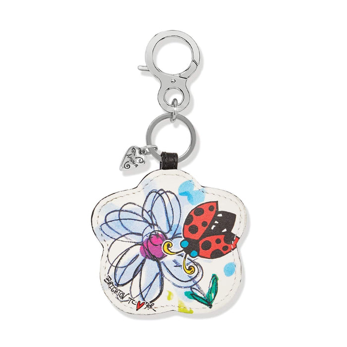 Brighton flower-shaped leather bag charm with illustrated ladybug and daisy print and silver-tone clip on a white background