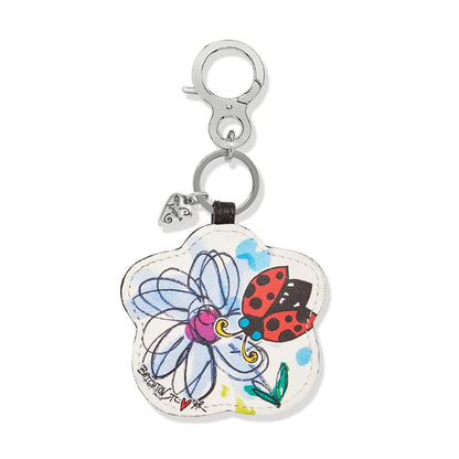 Brighton flower-shaped leather bag charm with illustrated ladybug and daisy print and silver-tone clip on a white background
