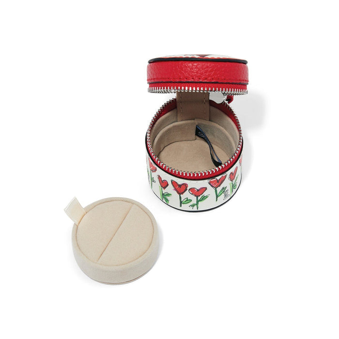 Brighton round leather jewelry case shown open with heart floral print, red zipper, and removable cushion insert on a white background