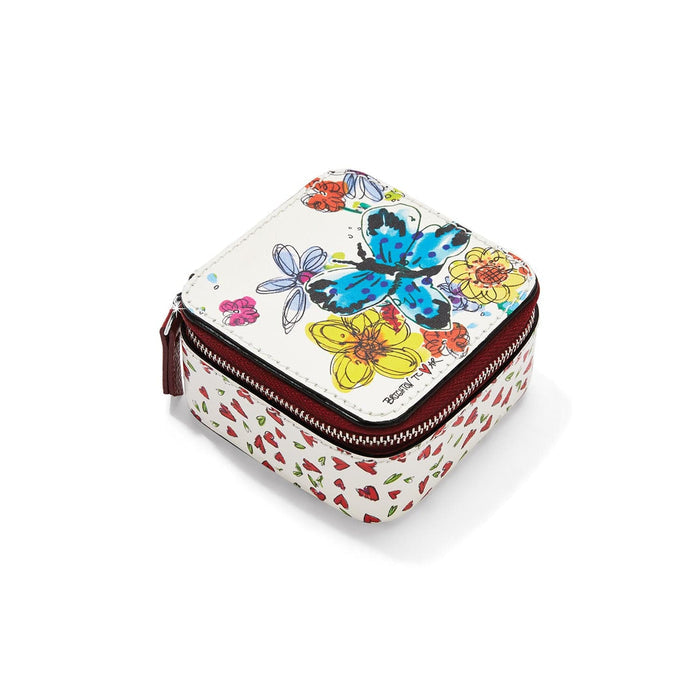 Brighton leather jewelry case with floral and butterfly print, red zipper closure, and heart-patterned sides on a white background