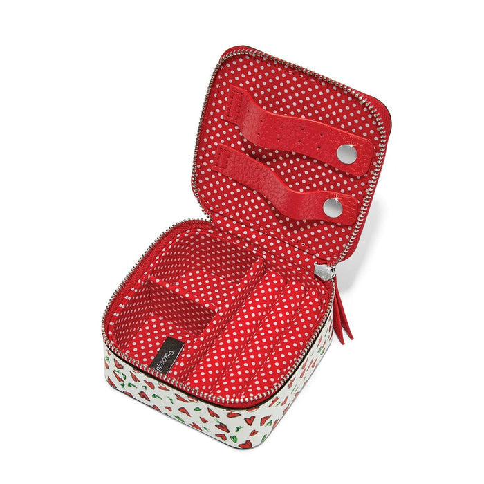 Brighton leather jewelry case shown open with red polka dot interior lining and snap closure straps on a white background