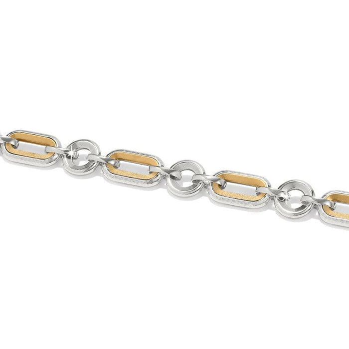 A silver and gold bracelet the Medici Two Tone Link Bracelet is composed of interlinked oval-shaped rings, varying in texture, against a white background.