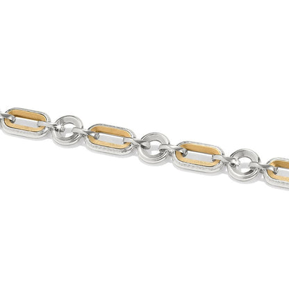 A silver and gold bracelet the Medici Two Tone Link Bracelet is composed of interlinked oval-shaped rings, varying in texture, against a white background.