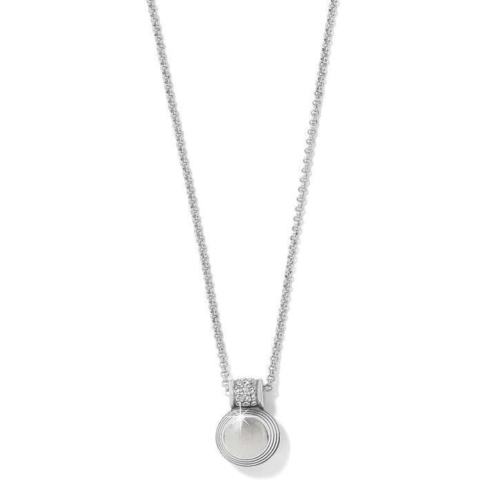 Brighton pendant necklace with silver-plated ridged circular pendant and crystal accented bail on a white background