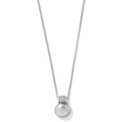 Brighton pendant necklace with silver-plated ridged circular pendant and crystal accented bail on a white background