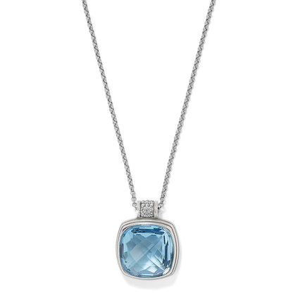 Brighton pendant necklace with faceted blue crystal and silver-plated bail accented with crystals on a white background