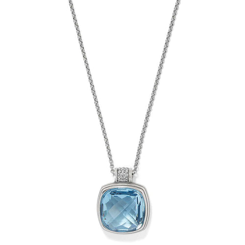 Brighton pendant necklace with faceted blue crystal and silver-plated bail accented with crystals on a white background