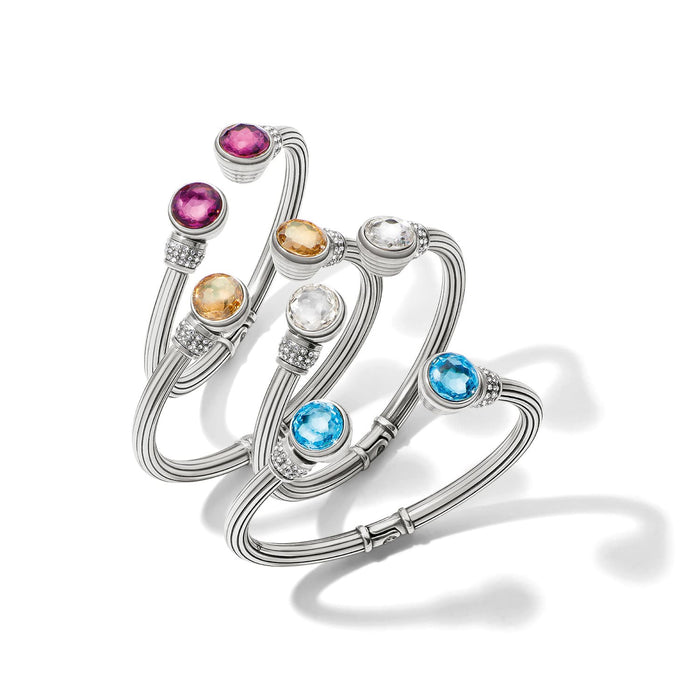 Brighton silver-plated bangle bracelets with pink, citrine, clear, and blue crystals and pavé accents on a white background