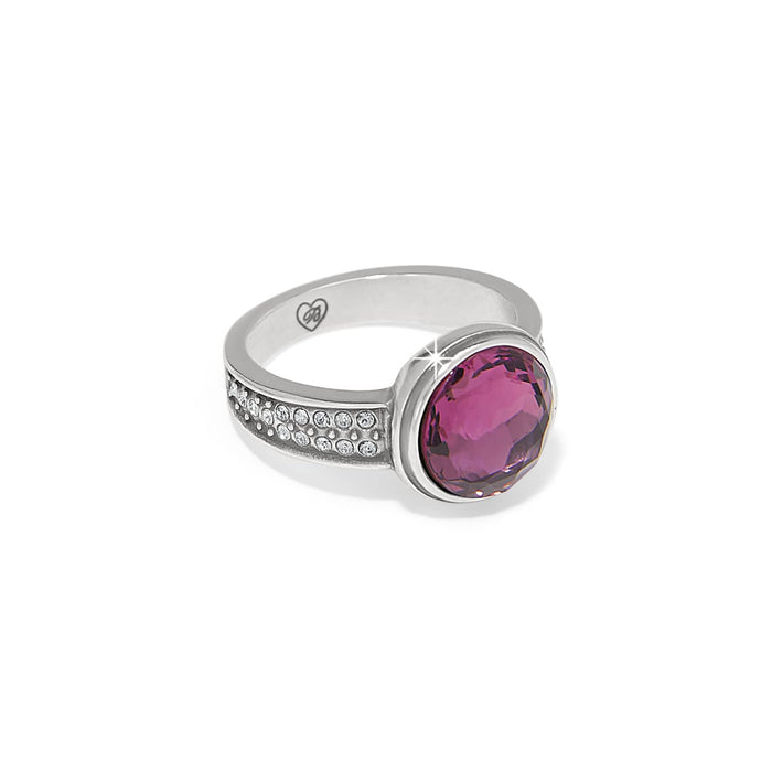 Brighton silver-plated ring with faceted purple crystal center and pavé crystal accents along the band on a white background