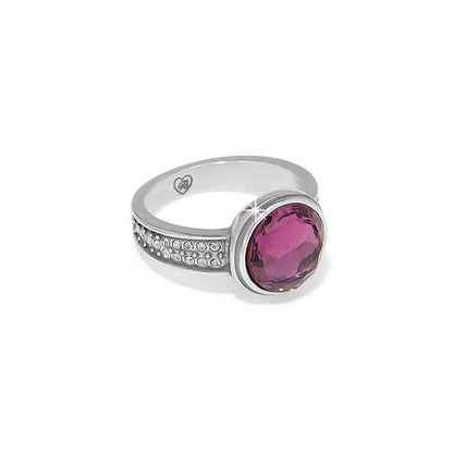 Brighton silver-plated ring with faceted purple crystal center and pavé crystal accents along the band on a white background