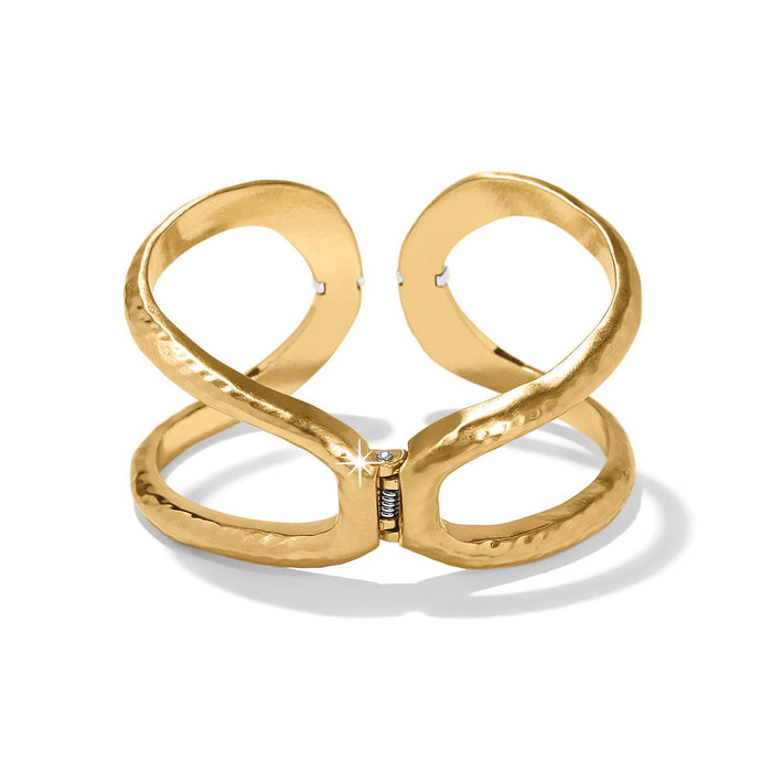 Brighton hinged cuff bracelet in gold-plated finish with hammered open design and crystal accent on a white background