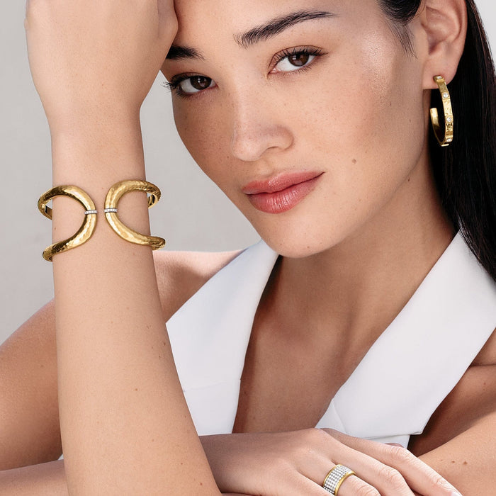 Model wearing Brighton gold-plated hammered cuff bracelets with crystal accents and coordinating Brighton accessories