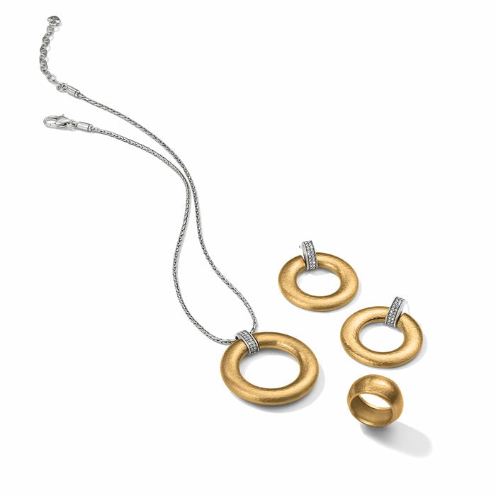 Brighton two-tone jewelry set styled with hammered gold rings, crystal accents, and silver chain necklace on white background