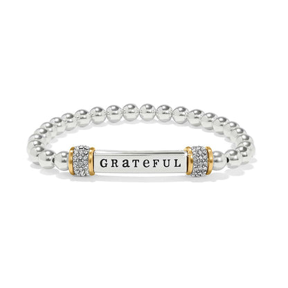 Brighton beaded stretch bracelet with Grateful bar, crystal pave accents, and two-tone finish on a white background