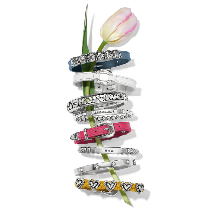 Brighton bracelets styled with a pink tulip, featuring silver-plated designs, beaded strands, and colorful leather bands