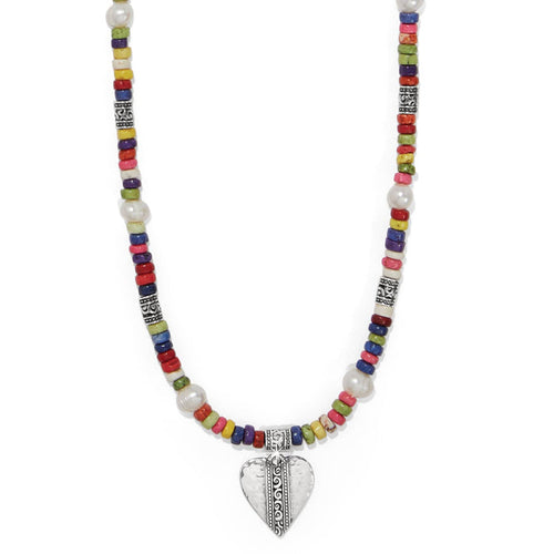 Brighton beaded necklace with multicolored heishi beads, potato pearls, silver-plated accents, and heart pendant on a white background