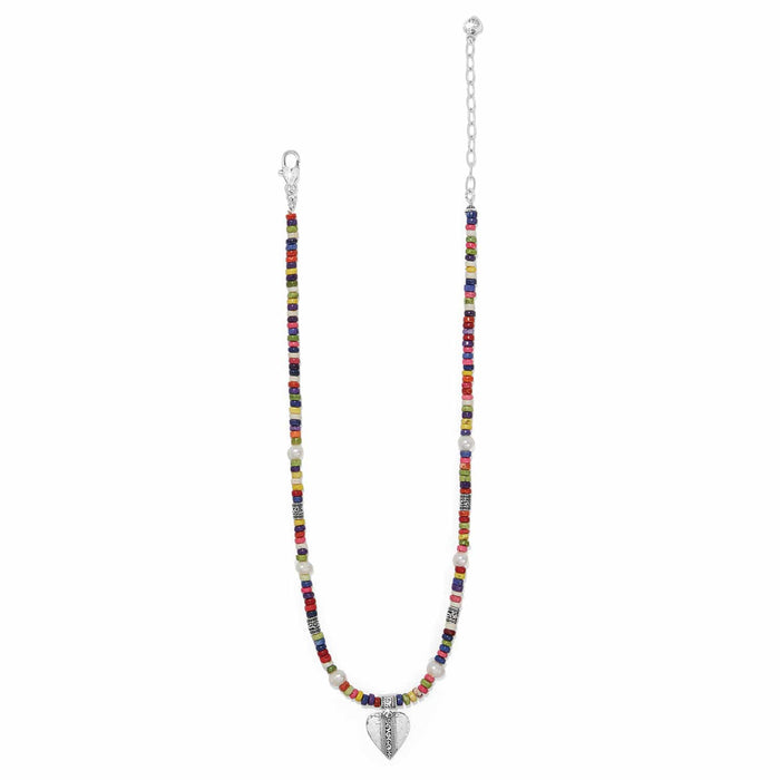 Brighton beaded necklace with multicolor heishi beads, potato pearls, silver-plated heart pendant and clasp on a white background
