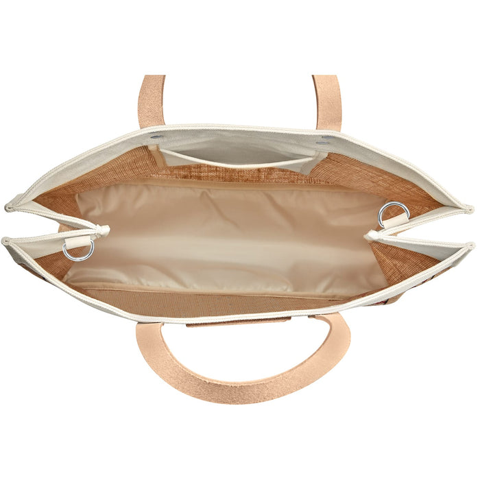 Brighton handbag interior view showing beige lining, cotton trim, silver-tone rings, and leather handles on a white background