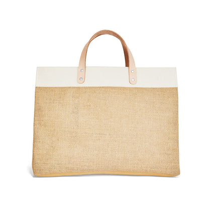 Brighton jute tote handbag with white canvas trim and tan leather top handles on a white background