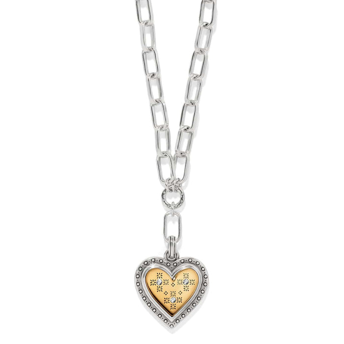 Brighton two-tone heart pendant necklace with silver chain links and gold heart charm with crystal accents on a white background