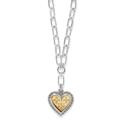 Brighton two-tone heart pendant necklace with silver chain links and gold heart charm with crystal accents on a white background