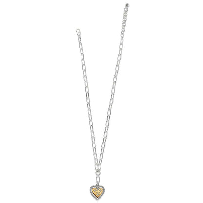 Brighton two-tone heart pendant necklace with gold center, crystal accents, and silver chain on a white background