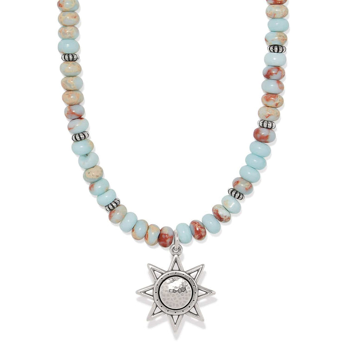 Brighton beaded necklace with turquoise and jasper beads and silver-plated star pendant on a white background